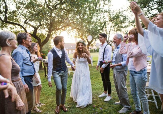 Bride and groom celebrate with their wedding party