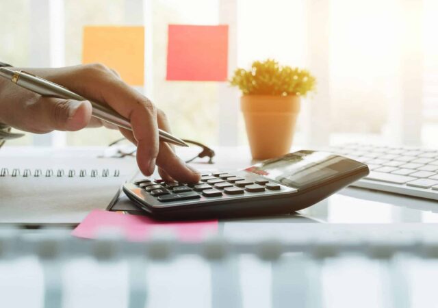 A person using a calculator