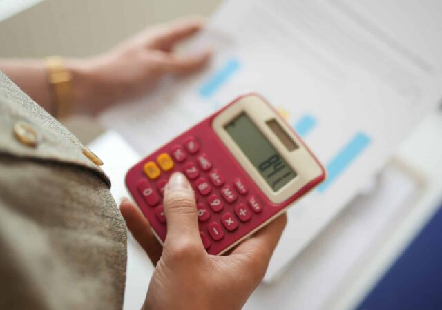 A person calculating aspects of their pension.